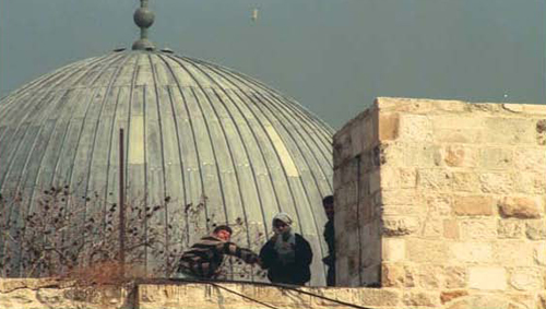 In times of tension the Muslim worshippers at Al-Aksa have attacked the worshippers at the Western Wall, hurling stones at them as here in the mid-'90s. (Avi Ochayon, Government Press Office)