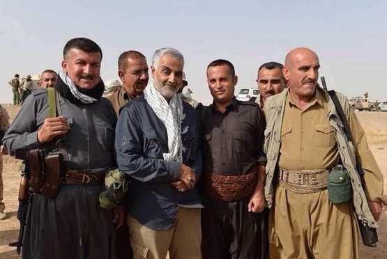 Qassem Suleimani, with scarf, the commander of the Revolutionary Guards Quds force, poses with a group of Kurdish Peshmerga fighters - Iran: Sana’a, Yemen Is “the Fourth Arab Capital in Our Hands”