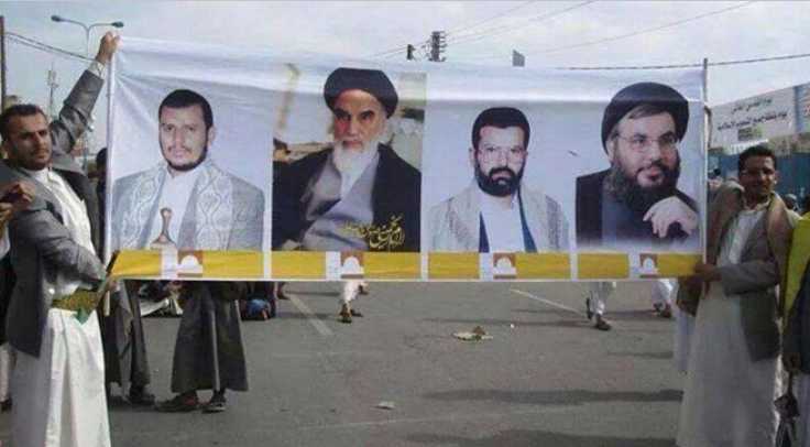 Houthis unfurl banner in Sana’a with pictures of (from left) current Houthi leader Abd Al-Malik Al-Houthi, Iranian Ayatollah Khomeini, the late Houthi founder and leader Hussein Badreddin al-Houthi, and Hizbullah leader Hassan Nasrallah.
