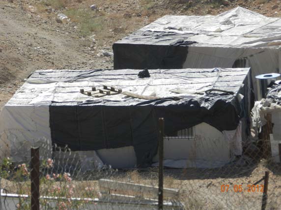 Prefab buildings br ought in without permits by Bedouin in the Mishor Adumim area, next to Route 1.