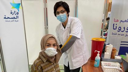 Arab Israelis and Palestinian residents in Jerusalem receive shots from Israeli health care organizations