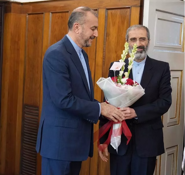 Assadollah (right) and Iranian FM